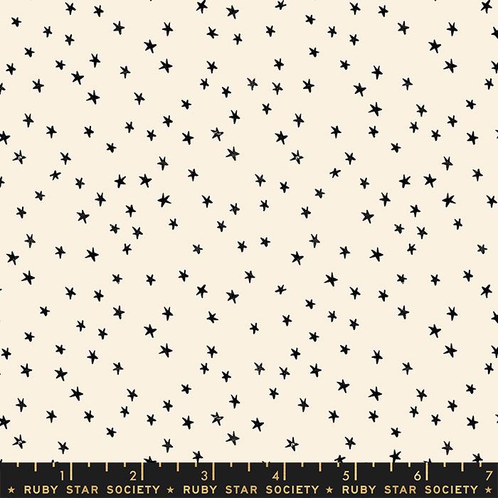 Pattern of small black stars on a beige background with Ruby Star Society label.